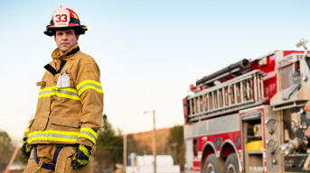 fire fighter standing near firetruck