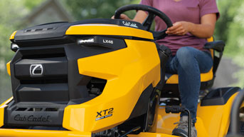 man pushing snow blower